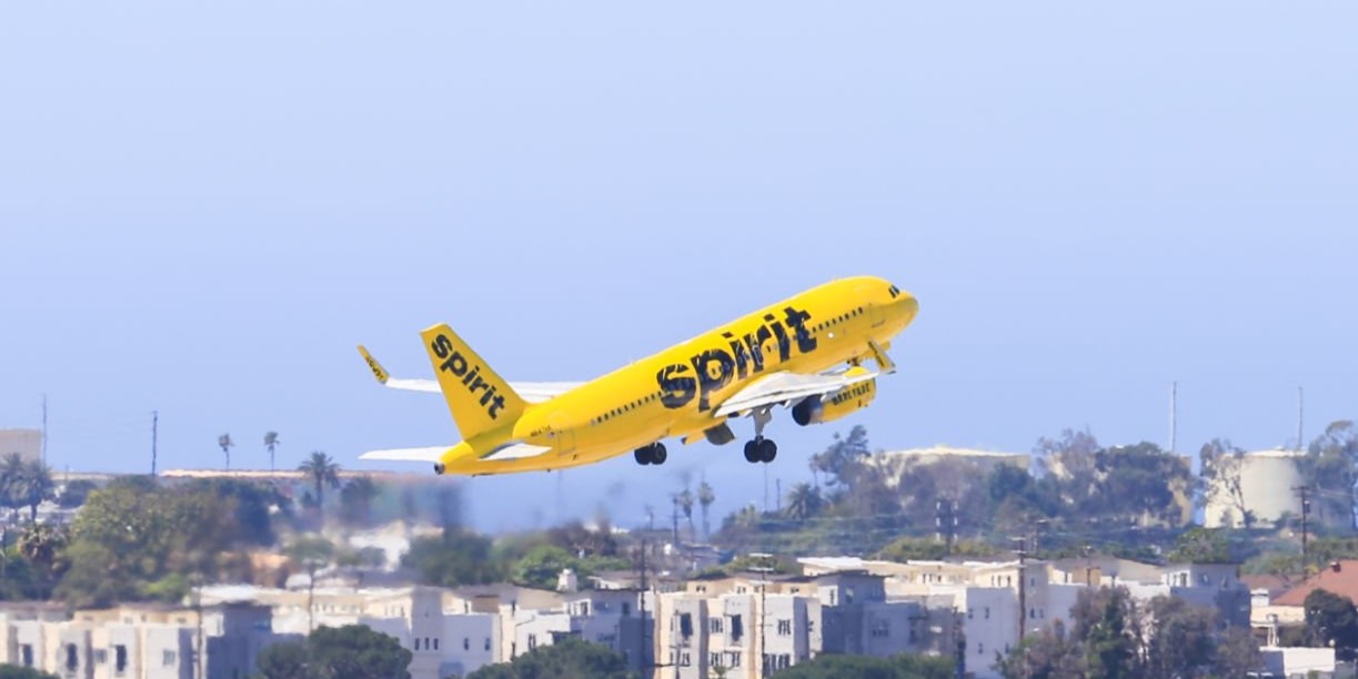 Los Angeles, California, USA - May 22, 2019: A Spirit Airlines Plane Takes Off From Los Angeles International Airport. In The Background You Can See The Airfield.